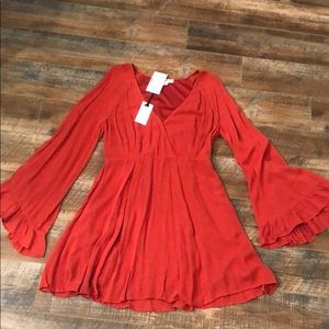 Orange tunic with ruffle detailed sleeves